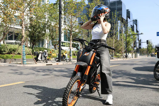 A young woman sitting on an adjustable speed eBike on an urban road, demonstrating its sleek design for city commuting.