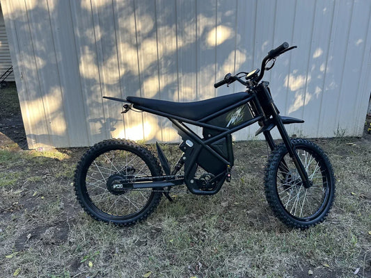 Riding Times eBike GT73 electric dirt bike with black frame and off-road tires parked outdoors