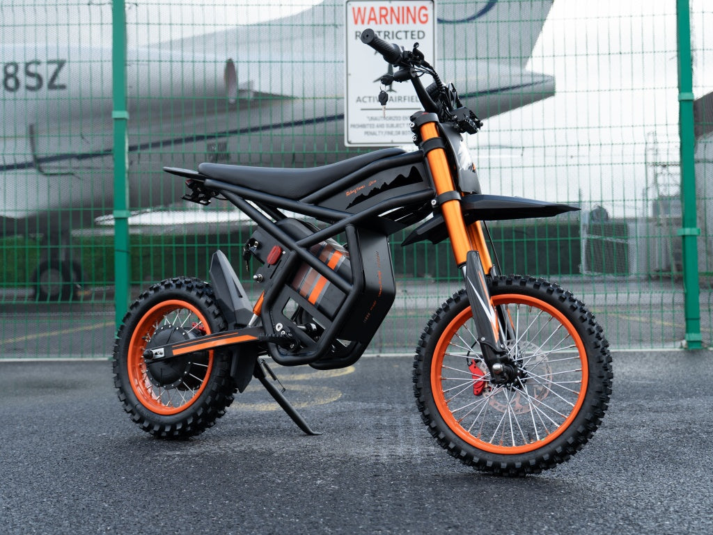 GT54 electric mini motorbike with orange accents and off-road tires for kids and adults
