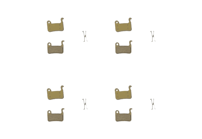 Brake Pads set with four pairs of metallic, gold-colored backing plates and friction material pads alongside small metal clips