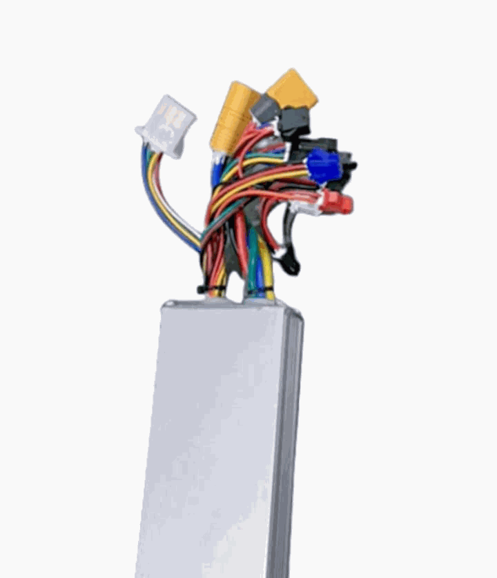 Controller with a silver rectangular metal casing and multiple colorful insulated wires and connectors attached at the top